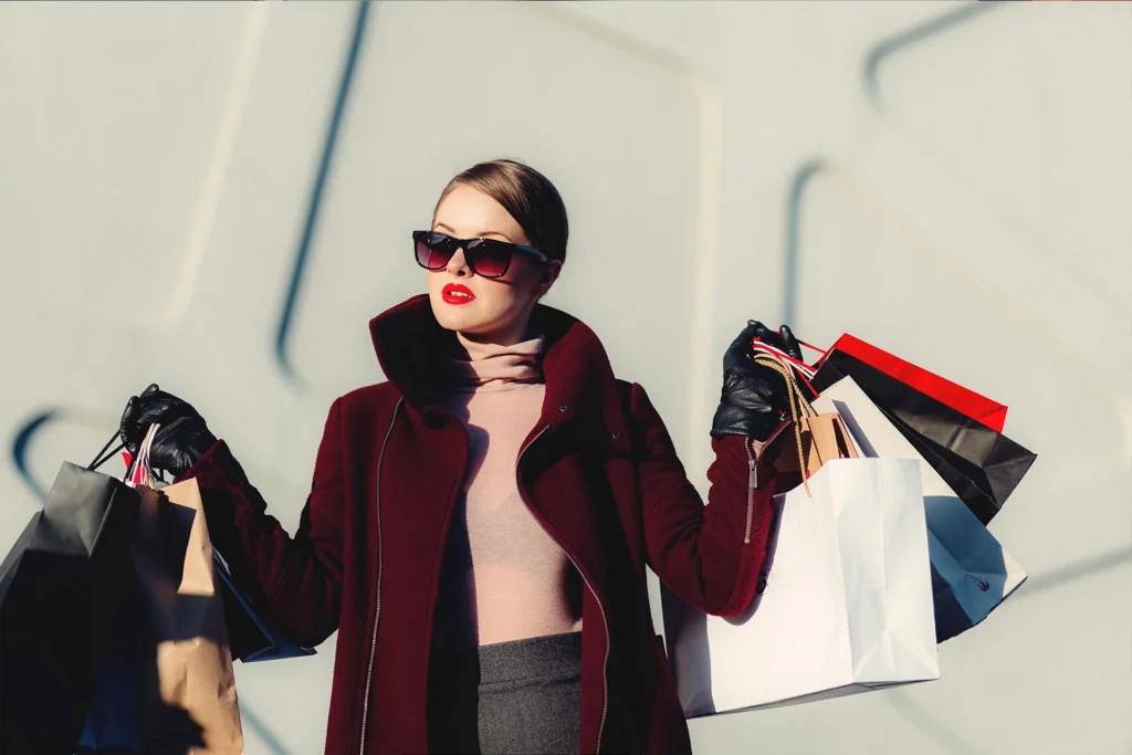 a girl with fashion bag clothes of top brands