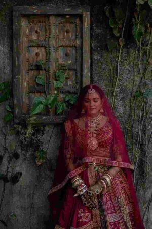 Bridal lehenga dupatta style: a heavily embroidered lehenga paired with a matching head-draped dupatta — exact match works here because the fabrics differ slightly in texture.