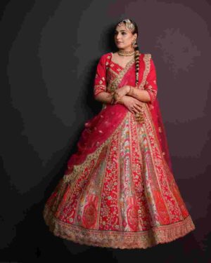 One-shoulder bridal dupatta draping style: the dupatta falls diagonally across the body — the most practical choice for receptions.