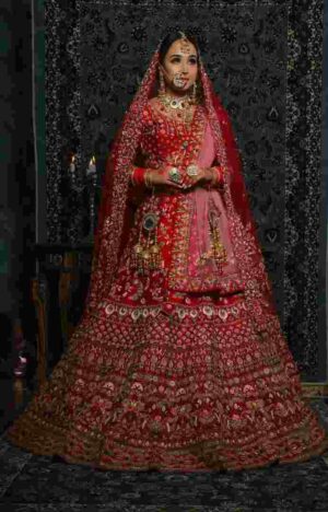 The bridal double dupatta style: one heavier dupatta worn over the head for ceremonies, with a lighter accent dupatta across the shoulder for the reception.